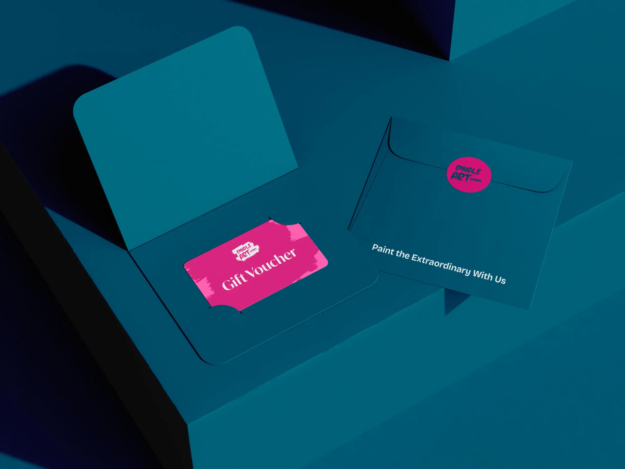 A teal envelope partially open reveals a pink gift voucher ticket inside. Another closed envelope with a red circle reads "Paint the Extraordinary With Us." The setting has a modern and minimalistic design.